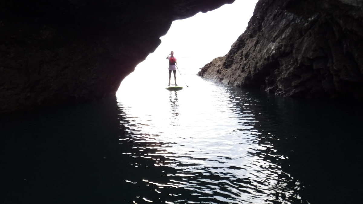 Paddling through a sea cave