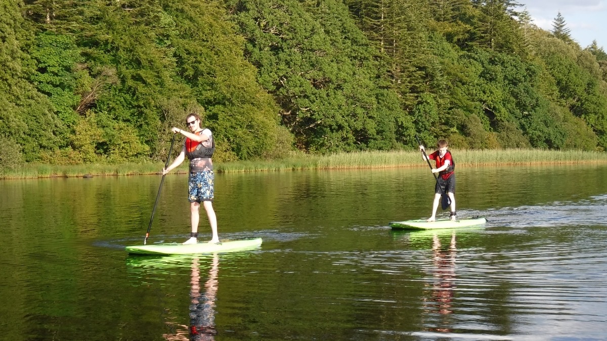 Paddlers on a still evening lake