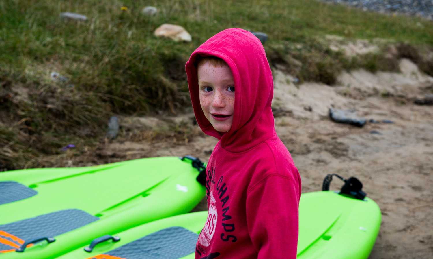 A young paddler on the beach