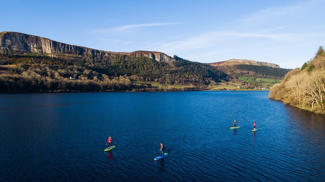Paddlers on Glencar Lake beneath the cliffs