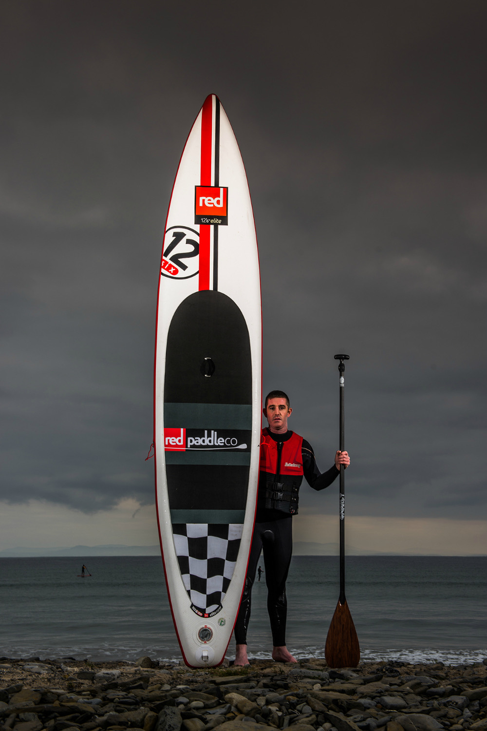 Niall Harte, founder of Sligo Bay SUP, with his race board
