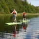 A man and a boy enjoying Stand Up paddling on Sligo lake
